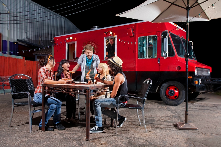Millennials gathered around a food truck